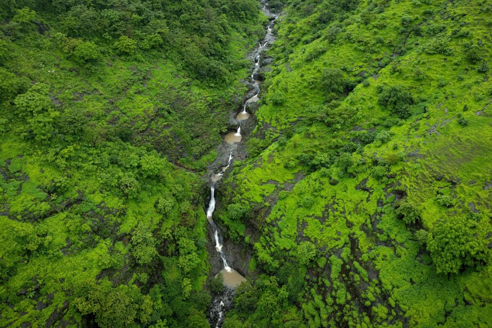 A drone shot of a Honokohau waterfall, Hawaii