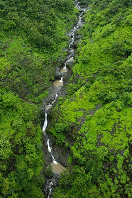 A drone shot of a Honokohau waterfall, Hawaii