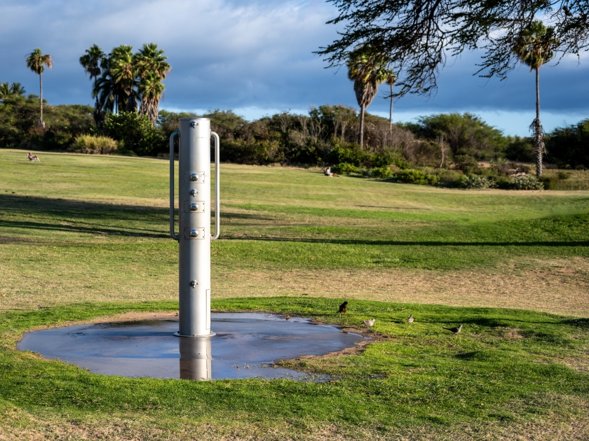 Public outdoor shower at Kamaole Beach Park III, for rinsing off salt water after playing in the surf, Maui, Hawaii