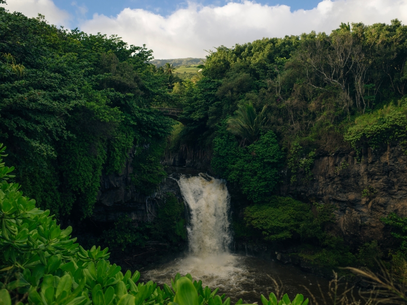 Dramatic series of waterfalls of Ohe'o Gulch cascading down a rocky under a bridge, in Haleakala National Park, Kipahula, Maui, Hawaii, USA. High quality photo