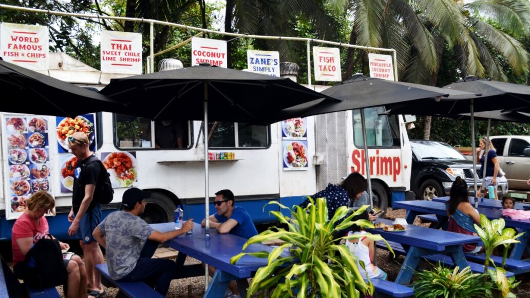 Oahu, Hawaii, United States, May 2nd 2018, people eating at a good truck