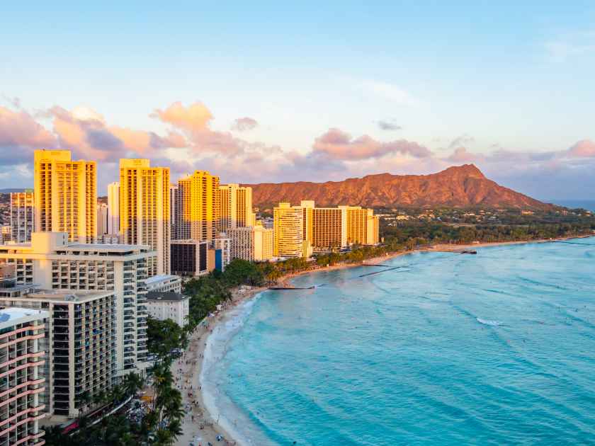 Waikiki Beach and Diamond Head Crater including the hotels and buildings in Waikiki, Honolulu, Oahu island, Hawaii. Waikiki Beach in the center of Honolulu has the largest number of visitors in Hawaii