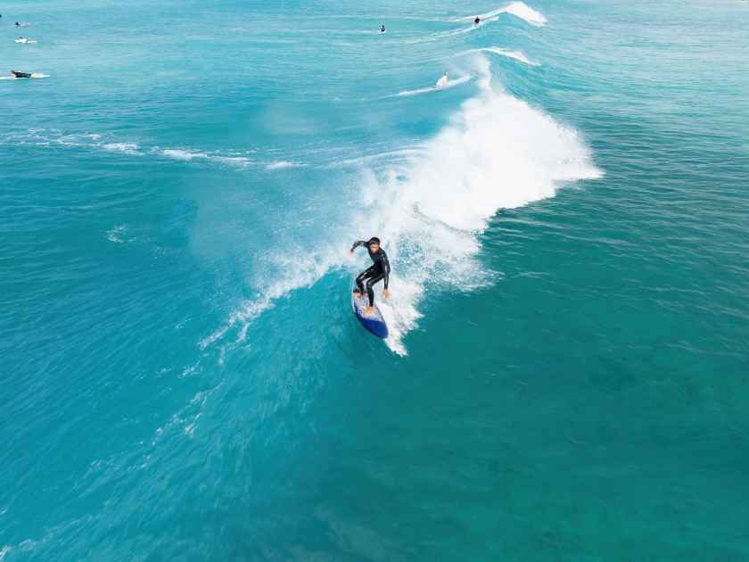 Surfer riding a wave in Hawaii