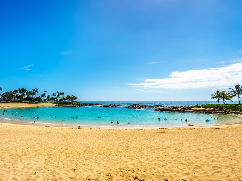 Blue sky and and white sand at Ko Olina Lagoon 3, named Nai'a Lagoon, at the resort community of Ko Olina on the West Coast of the Hawaiian island of Oahu