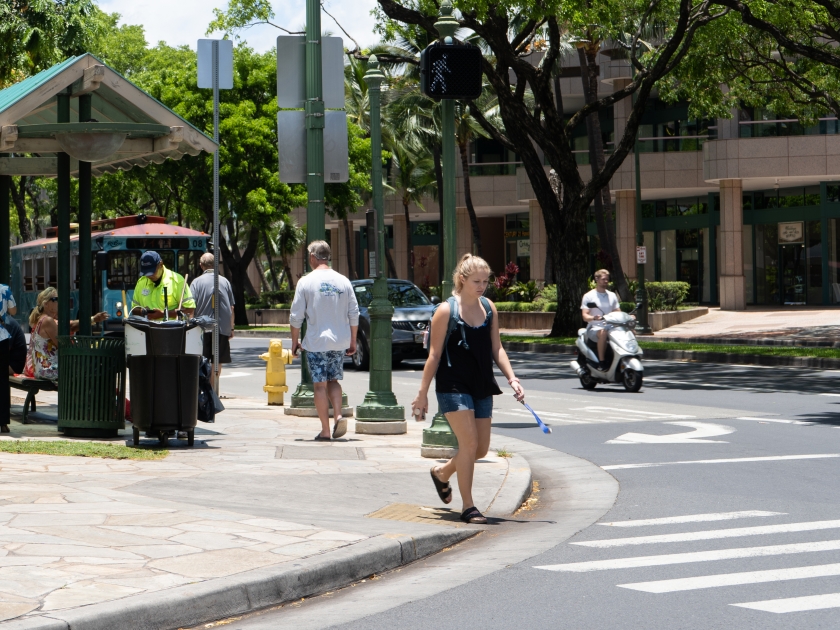 Honolulu, Hawaii, USA - June 19th, 2019: Pedestrians walking in the streets of Honolulu, Hawaii on a sunny day.