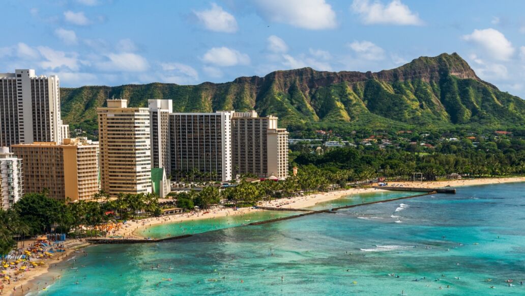 Hawaii panoramic Honolulu city travel landscape banner background of Waikiki beach and Diamond Head mountain peak at sunset, Oahu island, USA vacation.