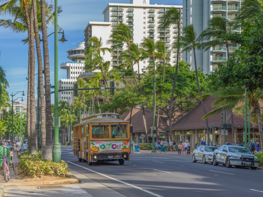 Honolulu, Hawaii, USA. Mar. 28, 2019. Waikiki trolley waiting for passengers on a warm Spring morning on Kalakaua Avenue.