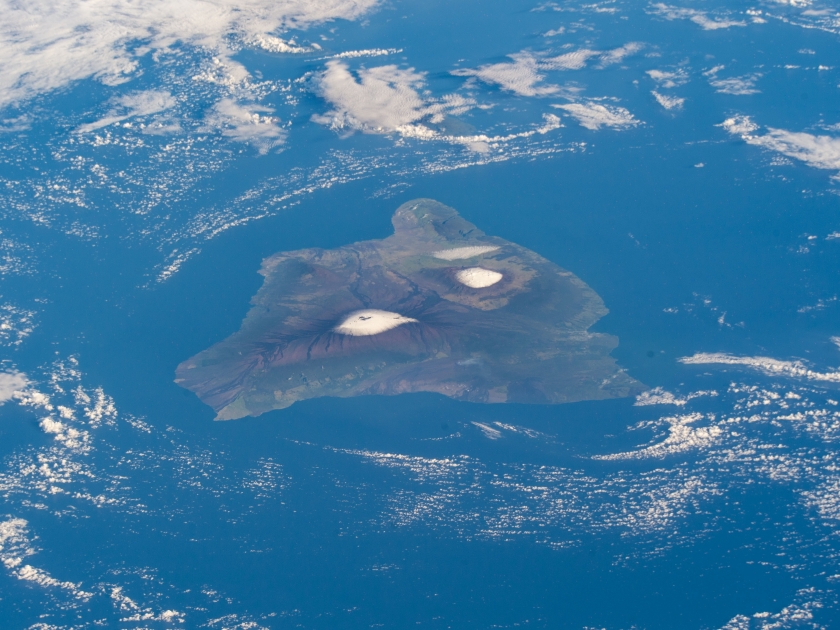 The big island of Hawaii and its two snow-capped volcanos, the active Mauna Loa and the dormant Mauna Kea pictured from the International Space Station as it orbited 260 miles above the pacific ocean