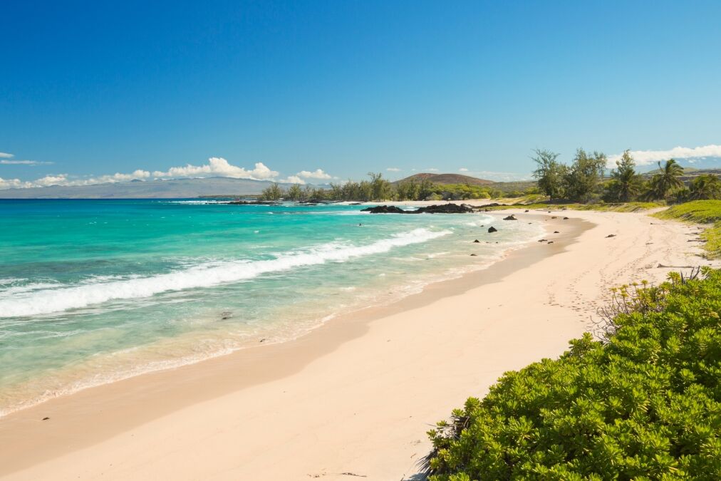 Makalawena Beach on Big Island Hawaii, USA, a beautiful remote white sand beach and turquoise water.