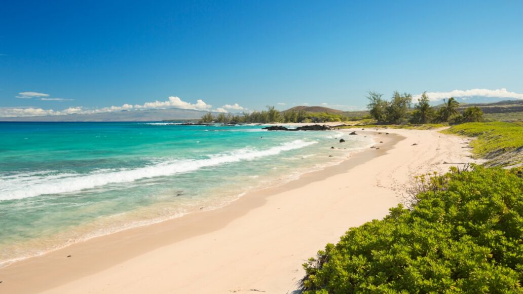 Makalawena Beach on Big Island Hawaii, USA, a beautiful remote white sand beach and turquoise water.