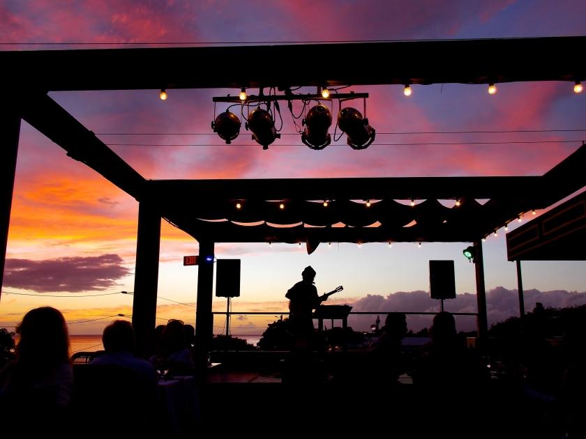 Musician Plays Guitar and Sings for a Crowd at Hawaiian Sunset