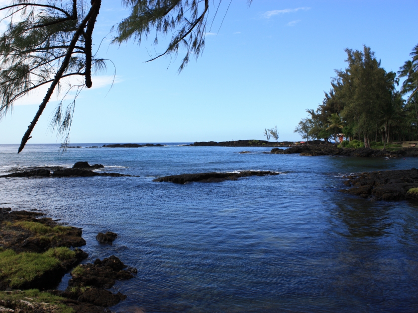 Black lava rock shoreline of Richardson's Beach Park in Hilo, Hawaii